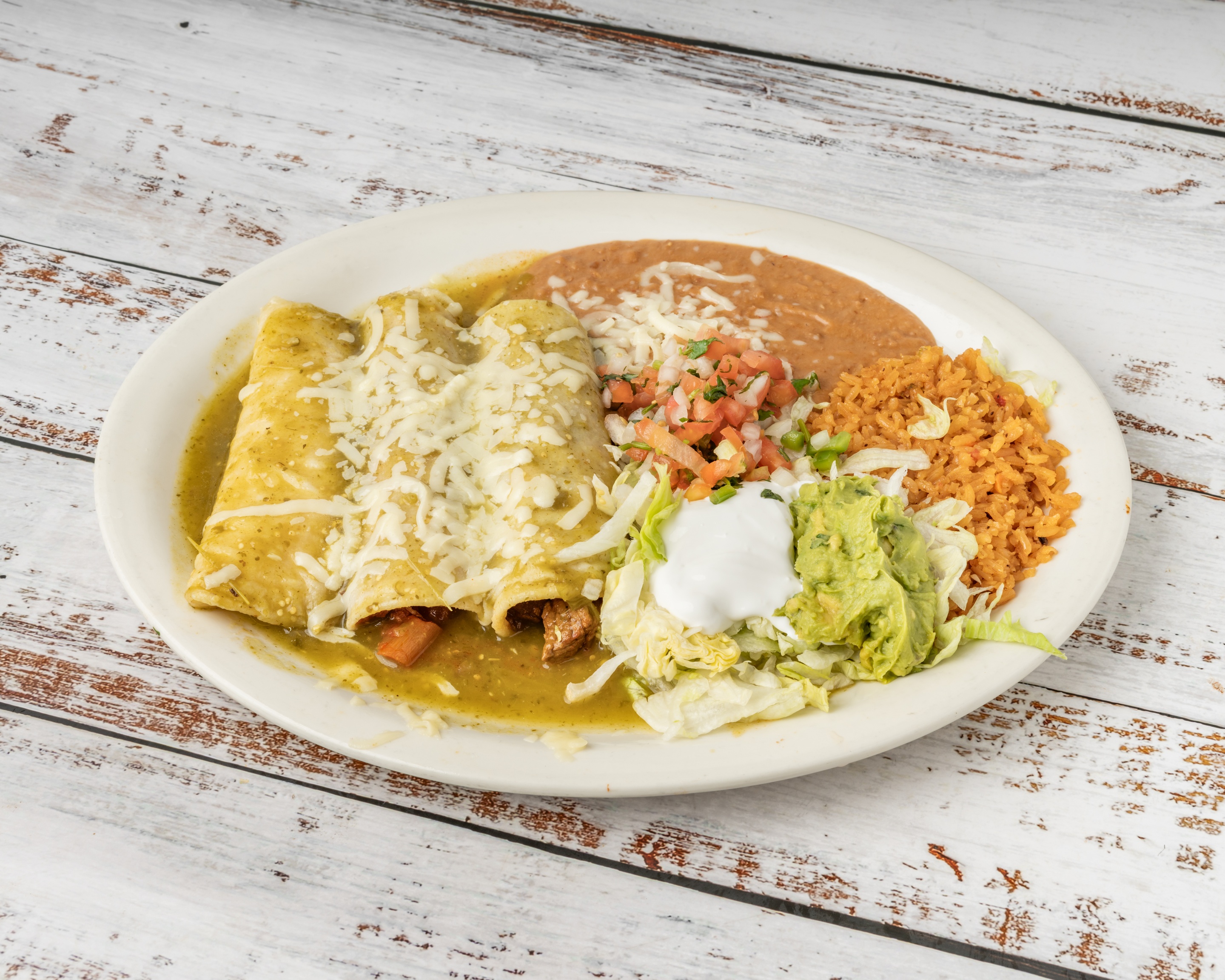 Enchiladas Suizas in creamy green sauce