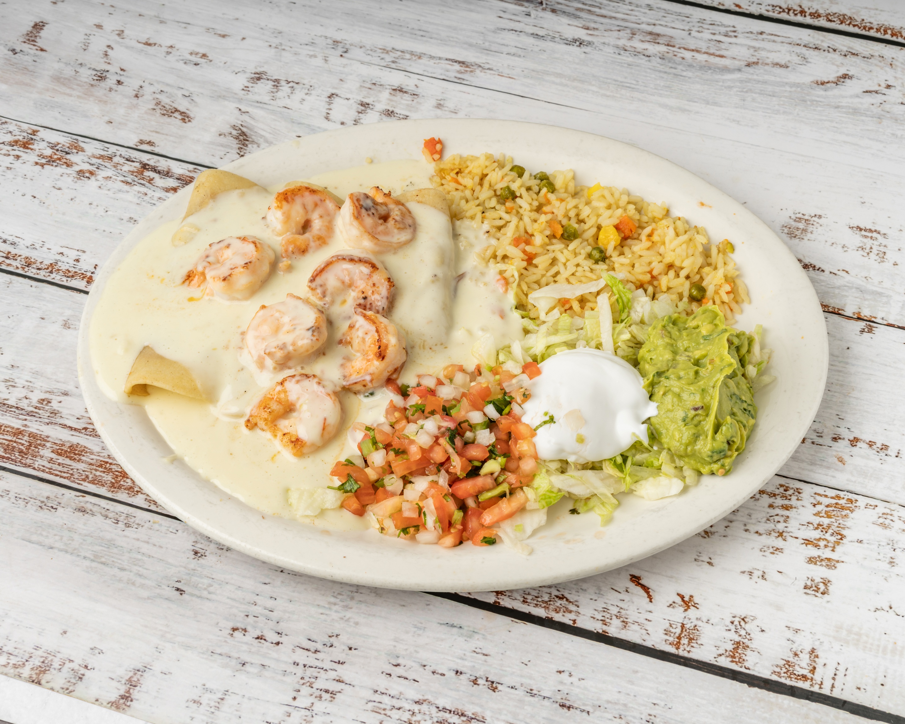 Shrimp Enchiladas with cheese sauce